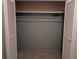 Large closet with ample storage space, featuring custom wallpaper and rod at 503 Sunset Rd, Plant City, FL 33563