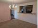 Open dining area with bar seating, showcasing the kitchen with stainless steel appliances at 503 Sunset Rd, Plant City, FL 33563