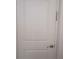 Interior white door with gold hardware and a security chain lock, offering privacy at 503 Sunset Rd, Plant City, FL 33563