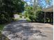 Long private driveway leading up to the house with mature trees at 503 Sunset Rd, Plant City, FL 33563