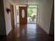 Inviting entryway with hardwood floors and a decorative glass front door at 503 Sunset Rd, Plant City, FL 33563