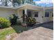 Welcoming front entrance with a covered porch and well-maintained landscaping at 503 Sunset Rd, Plant City, FL 33563