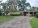 Charming single-story home featuring a covered carport, brick exterior and well-maintained landscaping at 503 Sunset Rd, Plant City, FL 33563