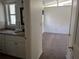 Bathroom leading to a brightly lit bedroom with neutral tones at 503 Sunset Rd, Plant City, FL 33563
