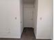 Clean hallway with neutral paint and carpet, leading to various rooms of the home at 503 Sunset Rd, Plant City, FL 33563