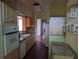 Kitchen with wooden cabinets, granite countertops and views to living areas at 503 Sunset Rd, Plant City, FL 33563