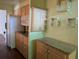 Bright kitchen with granite counters, light wood cabinets, and modern appliances at 503 Sunset Rd, Plant City, FL 33563