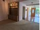 Bright living room featuring a built-in bookshelf and a chandelier at 503 Sunset Rd, Plant City, FL 33563