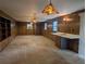 Spacious living room features wood paneling, stained glass light fixtures, and a convenient wet bar at 503 Sunset Rd, Plant City, FL 33563
