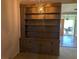 Living room featuring a built-in bookshelf and a chandelier at 503 Sunset Rd, Plant City, FL 33563