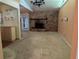 Cozy living room features a brick fireplace and access to outdoor patio at 503 Sunset Rd, Plant City, FL 33563