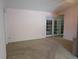 Spacious living room with light-colored walls and elegant french doors at 503 Sunset Rd, Plant City, FL 33563
