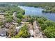Aerial view of the condos with a pool and lake view surrounded by lush greenery at 5122 Puritan Cir # 5122, Tampa, FL 33617