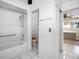 Clean bathroom featuring a shower-tub combo and separate toilet area for added privacy at 5122 Puritan Cir # 5122, Tampa, FL 33617