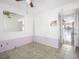 Bedroom featuring tiled flooring, ceiling fan, and pastel wall at 5122 Puritan Cir # 5122, Tampa, FL 33617
