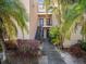 The exterior of the condos features greenery and a walkway to each unit at 5122 Puritan Cir # 5122, Tampa, FL 33617