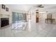 Living Room features tiled floors, fireplace, bar and views of the lake at 5122 Puritan Cir # 5122, Tampa, FL 33617