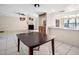 Open-concept living area with tile floors, pass through kitchen bar and dining area at 5122 Puritan Cir # 5122, Tampa, FL 33617