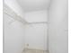 Walk-in closet with storage shelving for organization at 5122 Puritan Cir # 5122, Tampa, FL 33617