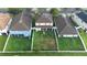 Aerial of back of home with a big, fenced yard with mature landscaping, screened in lanai and large manicured lawn at 533 Vista Ridge Dr, Ruskin, FL 33570