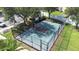 Aerial view of a fenced basketball court with green and maroon coloring surrounded by landscaping at 533 Vista Ridge Dr, Ruskin, FL 33570