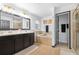 A well-appointed bathroom featuring a double vanity, soaking tub, and separate glass-enclosed shower at 533 Vista Ridge Dr, Ruskin, FL 33570