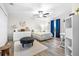A well-lit bedroom with a ceiling fan, stylish furniture, and a cozy rug, perfect for relaxation and comfort at 533 Vista Ridge Dr, Ruskin, FL 33570