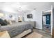 A spacious bedroom featuring light blue walls, wood floors, and an ensuite bathroom for added convenience at 533 Vista Ridge Dr, Ruskin, FL 33570