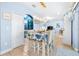 Bright dining space featuring modern lighting and convenient access to the kitchen and other living areas at 533 Vista Ridge Dr, Ruskin, FL 33570