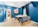 Dining room featuring blue walls, tile flooring, with a modern dining set and decor at 533 Vista Ridge Dr, Ruskin, FL 33570