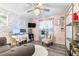 Inviting living room featuring a plush rug, and a well-lit workstation, with a gray sofa at 533 Vista Ridge Dr, Ruskin, FL 33570