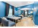 This comfortable living room includes black accents and vibrant blue walls, offering a colorful aesthetic at 533 Vista Ridge Dr, Ruskin, FL 33570