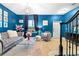 Stylish living room featuring blue walls, tile flooring, and modern decor at 533 Vista Ridge Dr, Ruskin, FL 33570