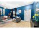 Stylish living room featuring blue walls, tile flooring, and modern decor at 533 Vista Ridge Dr, Ruskin, FL 33570