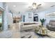 An open-concept living room showcases modern furniture, a stylish rug, and seamless flow into the dining area at 533 Vista Ridge Dr, Ruskin, FL 33570