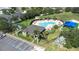 Aerial view of a community pool, playground and tennis court surrounded by landscaping at 533 Vista Ridge Dr, Ruskin, FL 33570