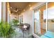 Charming screened porch featuring comfortable seating and lush potted plants at 533 Vista Ridge Dr, Ruskin, FL 33570