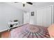 Stylish bedroom featuring hardwood floors, natural light, a double door closet and ceiling fan at 5422 Wilkins Trl, Brooksville, FL 34602