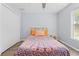 Comfortable bedroom featuring natural light, double door closet, hardwood floors and ceiling fan for added relaxation at 5422 Wilkins Trl, Brooksville, FL 34602