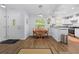Cozy dining area with wood floors, natural light, and view into kitchen at 5422 Wilkins Trl, Brooksville, FL 34602