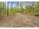 Gated long driveway and mature surrounding trees at 5422 Wilkins Trl, Brooksville, FL 34602