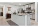 Open kitchen featuring granite countertops, stainless steel appliances, and tile flooring at 5687 Barakat Rd, Zephyrhills, FL 33541