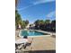 A community pool with clear blue water with plenty of seating and space for residents to relax and enjoy at 6306 Newtown Cir # 6A3, Tampa, FL 33615