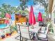 Relaxing backyard area with patio seating, pool, shed, and manicured landscaping is perfect for outdoor enjoyment at 6425 S Adelia Ave, Tampa, FL 33616