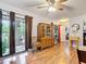 Cozy dining area with hardwood floors, sliding door access to outdoor area, adjacent to other rooms at 6425 S Adelia Ave, Tampa, FL 33616