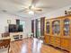 A living room featuring wood floors, a ceiling fan, and a glass sliding door at 6425 S Adelia Ave, Tampa, FL 33616