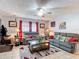 Inviting living room features comfortable seating, tile flooring, and plenty of natural light at 6425 S Adelia Ave, Tampa, FL 33616