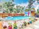Above-ground pool surrounded by potted plants and a wooden fence, offering a private and serene retreat at 6425 S Adelia Ave, Tampa, FL 33616