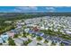 Stunning aerial view of a waterfront community with houses alongside canals and waterways at 6528 Simone Shores Cir, Apollo Beach, FL 33572