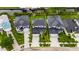 Detailed aerial view of a property with a paved driveway and tropical landscaping near the waterfront at 6528 Simone Shores Cir, Apollo Beach, FL 33572